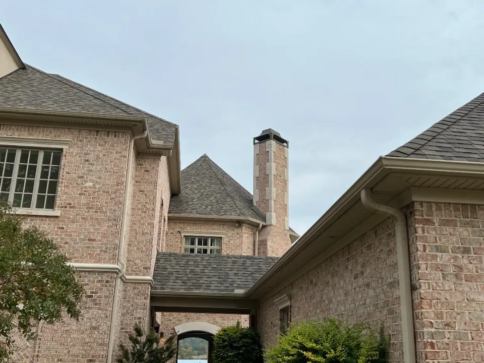 Brick home with chimney and new roof