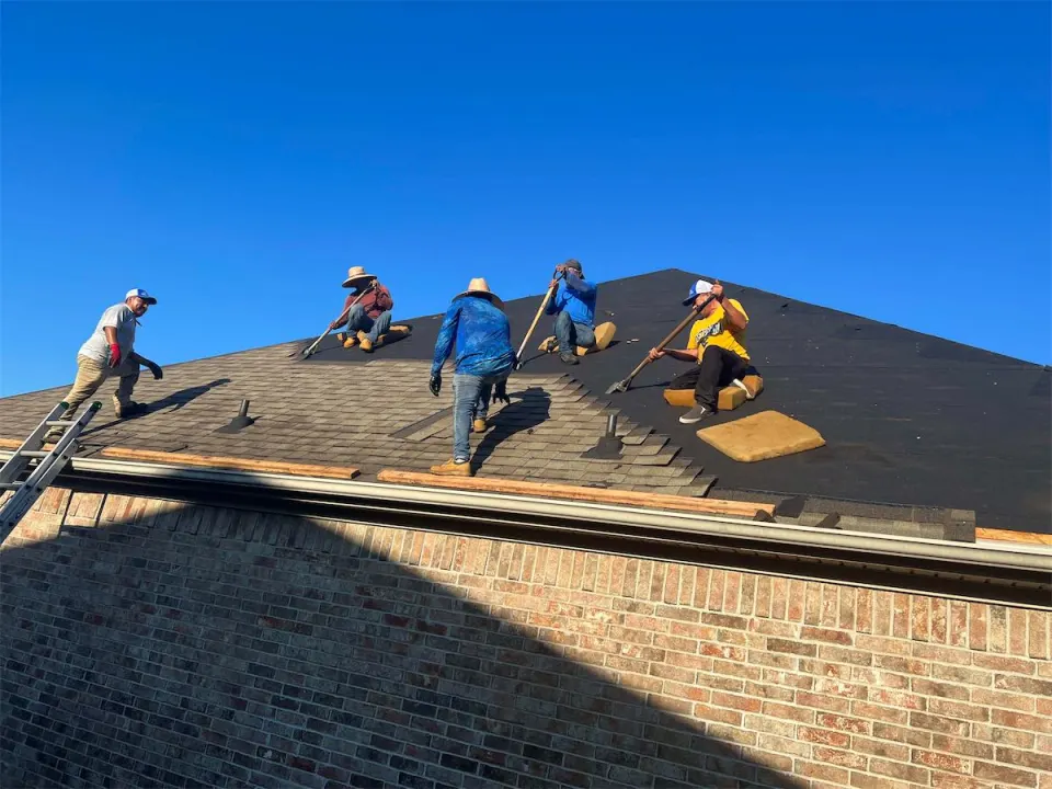 Landon Roofing crew installing a new shingle roof in Central Arkansas